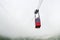 Red funicular or red suspension cable car to Lomnicky peak in fog or clouds, High Tatry, Slovakia