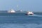 Red funnel car ferry and passenger catamaran passing in the Solent Isle of Wight England