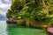 Red garden arch Walk of Lovers on coast leading towards the historic city of Varenna on edge of Lake Como in northern