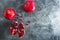 Red garnet fruits on dark background. Food background. Flat lay, top view