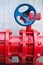 Red gas pipe with blue valve