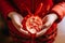 Red gift bag, hongbao envelope in the hands of a child, Chinese tradition