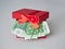 A red gift box filled with Euro currency money. Banknotes with a nominal value of 100 euros