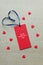 Red gift tag with typewriter HAPPY VALENTINES DAY and blue ribbon