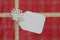 Red gift wrapped package with large blank tag