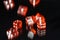 Red glass dices isolated on black background