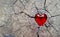 Red Glass Heart on Cracked Timber