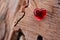 Red Glass Heart with soft focus wood background