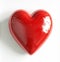 Red glass heart on white background, romanticism, glass heart sculpture