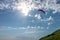 Red Glider in blue cloudy sky over the Green Mountain