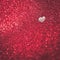 Red glittery background with a heartshaped cutout