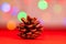 Red glittery decoration in a colorful Christmas composition isolated on background of blurred lights