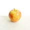 Red glossy apple on white background with clean top side for news article. Template healthy food with eco fruit. Close-up