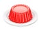 Red glossy jelly on plate over white background