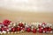 Red and Gold Beaded Necklaces Frame Gold Glitter Background