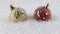 Red and Gold Christmas baubles with falling snow