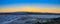 Red Golden Winter Sunset On The Horizon Of Hilly Snow Field Farmland Under Darken Blue Sky, Washington, United States