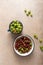 Red gooseberries in white enamel bowl and cup