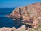 Red granite cliffs on Muckle Roe, Shetland, UK