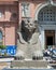 Red granite sphinx of Thutmose III in front of the Museum of Egyptian Antiquities in Cairo, with tourists.