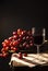 Red grape wine on wooden table and black background. home made nature wine with fresh red grapes.