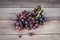 Red grape on wooden table - Bunch of grapes juicy fruit