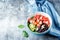 Red grapefruit beet spinach tomato salad in a bowl