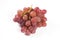 Red grapes over white background.