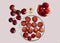 Red grapes, Petri dishes with slice of red grape and grape skin and grape seeds oil