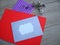 Red and gray envelope and flower