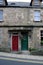 Red and Gree Doors on a House