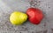 Red and green anjou pears on a gray mottled background