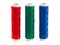 Red, green and blue sewing yarn rolls