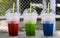 Red, Green, Blue soft drinks in the plastic tumbler