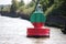 Red green buoy in the waterway marking that both sides can be used in river Noord in The Netherland