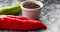 Red, green cayenne hot chili pepper on black, white background immune support healthy eating concept