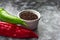 Red, green cayenne hot chili pepper on black, white background immune support healthy eating concept