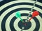 Red and Green dart target arrow hitting on bullseye which is the ultimate goal that everyone wants, Target marketing and business