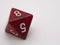 Red and green eight-sided die displaying a 8