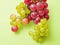 Red green grape shape On a green background,