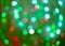 Red and green holiday bokeh. Abstract Christmas background