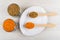 Red and green lentils in glass, in spoons in plate