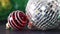 Red and green little Christmas ornaments and disco shiny ball ornament in the middle