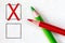 Red and green pencils with marking checkbox