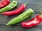 Red and green pepper chilly cooking on a black background