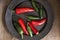 Red and green peppers in vintage retro moody natural lighting se