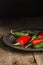 Red and green peppers in vintage retro moody natural lighting se