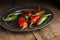 Red and green peppers in vintage retro moody natural lighting se