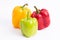 Red and green sweet peppers on a white background. Multicolored vegetables in the composition. Red and green sweet peppers on a wh