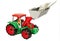 Red and green toy bulldozer with dollars